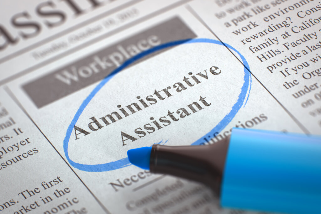 Administrative assistant job opening on newspaper.