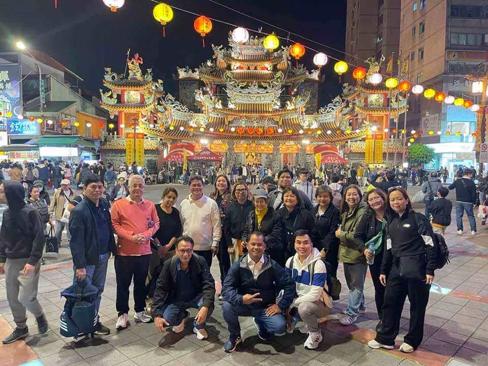 a group of people posing for a photo in Taiwan