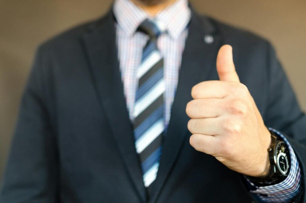 Man In Black Formal Suit Jacket giving the thumbs up